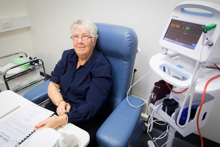 Margaret Ashby sits connected to a heart rate monitor.