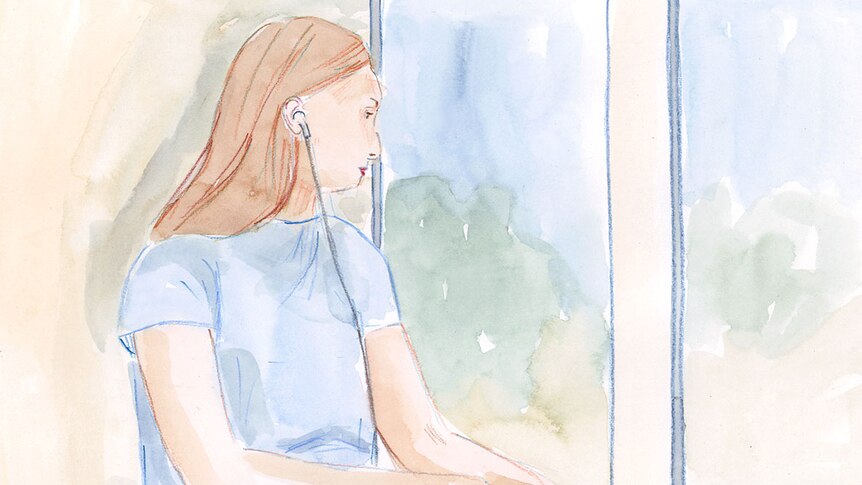 Girl listens to old tapes with her headphones on while on the train. He expression is sad.