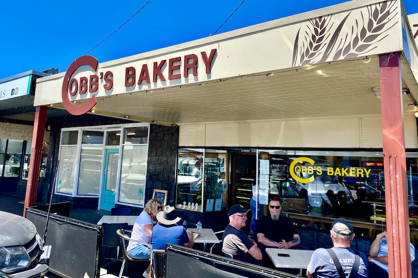 Customers sit outside Cobb's Bakery in Port Fairy