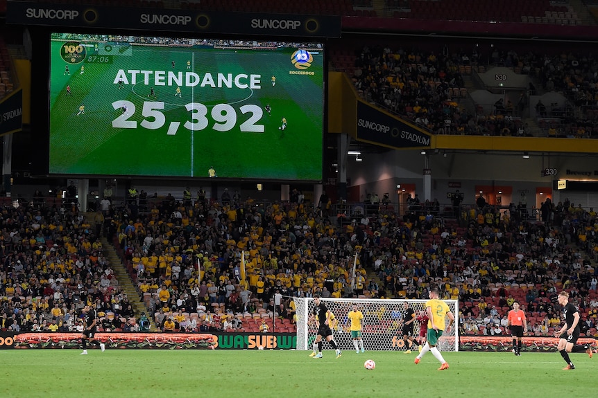 An attendance figure of 25,392 flashes on the big screen during a Socceroos game at Lang Park.