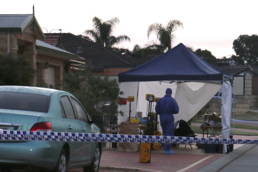 Police officers and cars outside a Perth house with police tape cordoning off the street.
