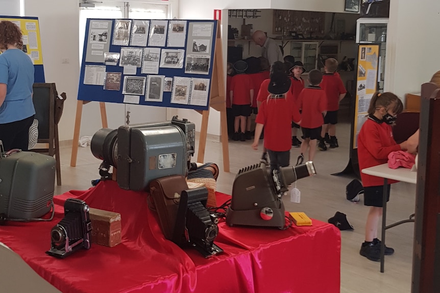 exhibition space featuring old cameras.