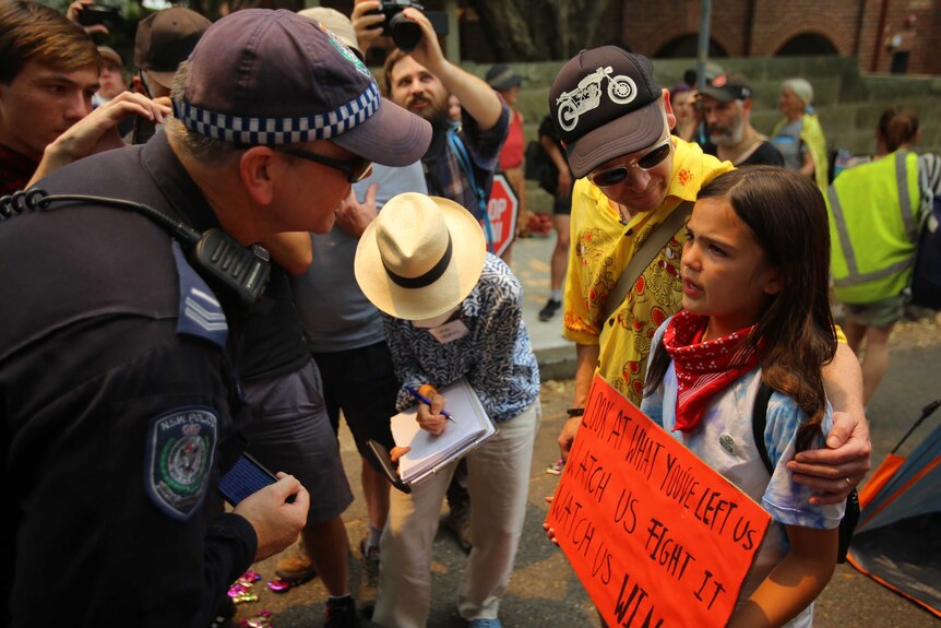 A young girl crying after being spoken to by police