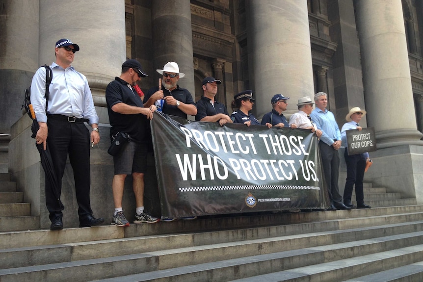Police officers protest compensation changes