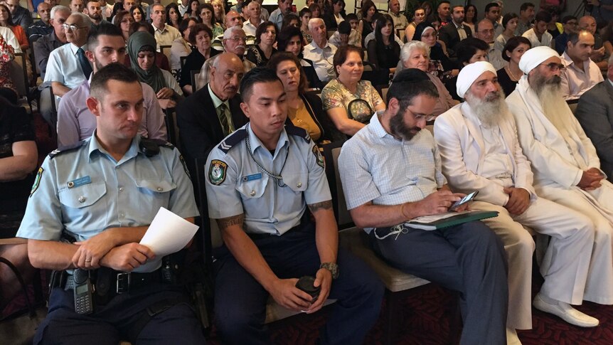 Police and community leaders attend a forum on extremism.