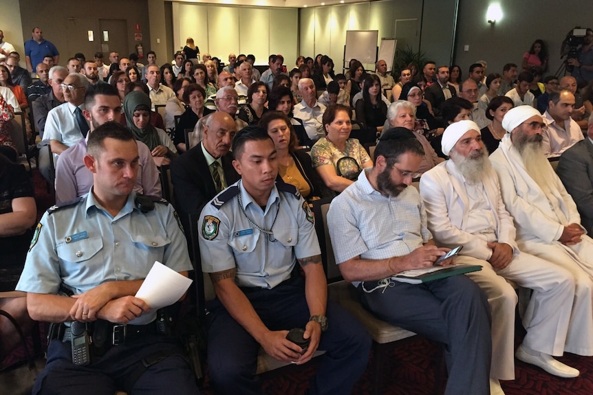 Police and community leaders attend a forum on extremism.