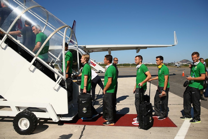 Socceroos board plane to Salvador