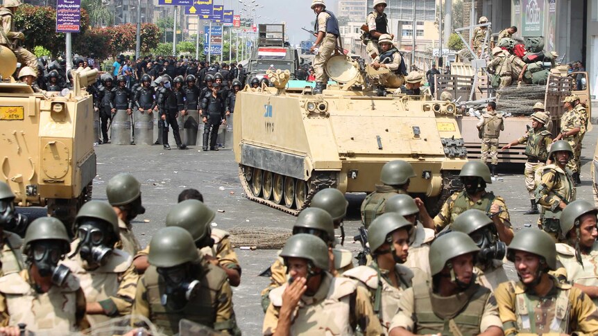 Riot police and army personnel take up position during clashes with members of the Muslim Brotherhood.