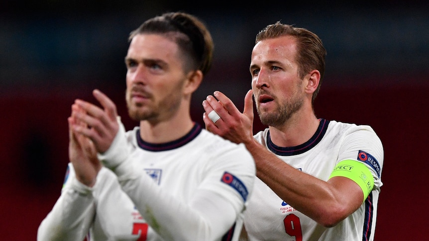  Harry Kane and Jack Grealish clap the supporters