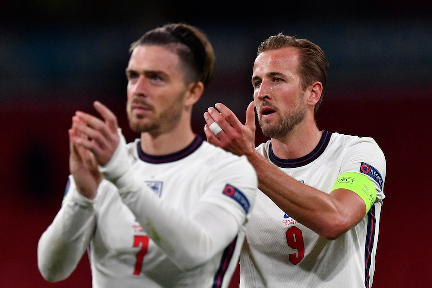  Harry Kane and Jack Grealish clap the supporters