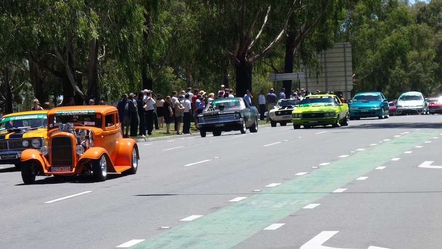 Cars take part in the Summernats Citycruise in Canberra.