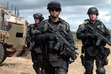Heavily armed men in defence exercise
