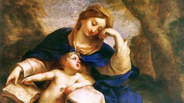 A painting depicting a mother, draped in blue and gold, looking down at her cherubic child