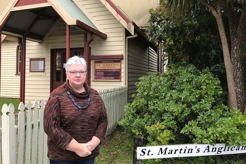 Shirley Scolyer in front of St Martin's Anglican Church