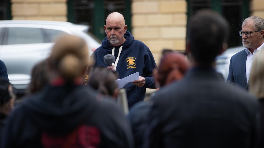 Neil Brooksbank addresses a crowd at a rally.