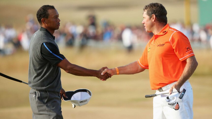 Tiger Woods and Britain's Lee Westwood shake hands after the third round of the British Open.