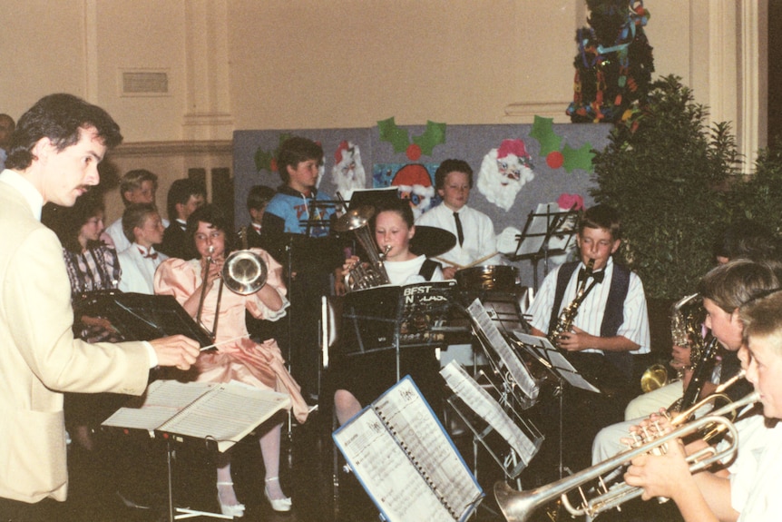 A children's orchestra playing various instruments