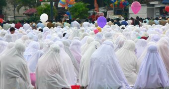 A group of women praying