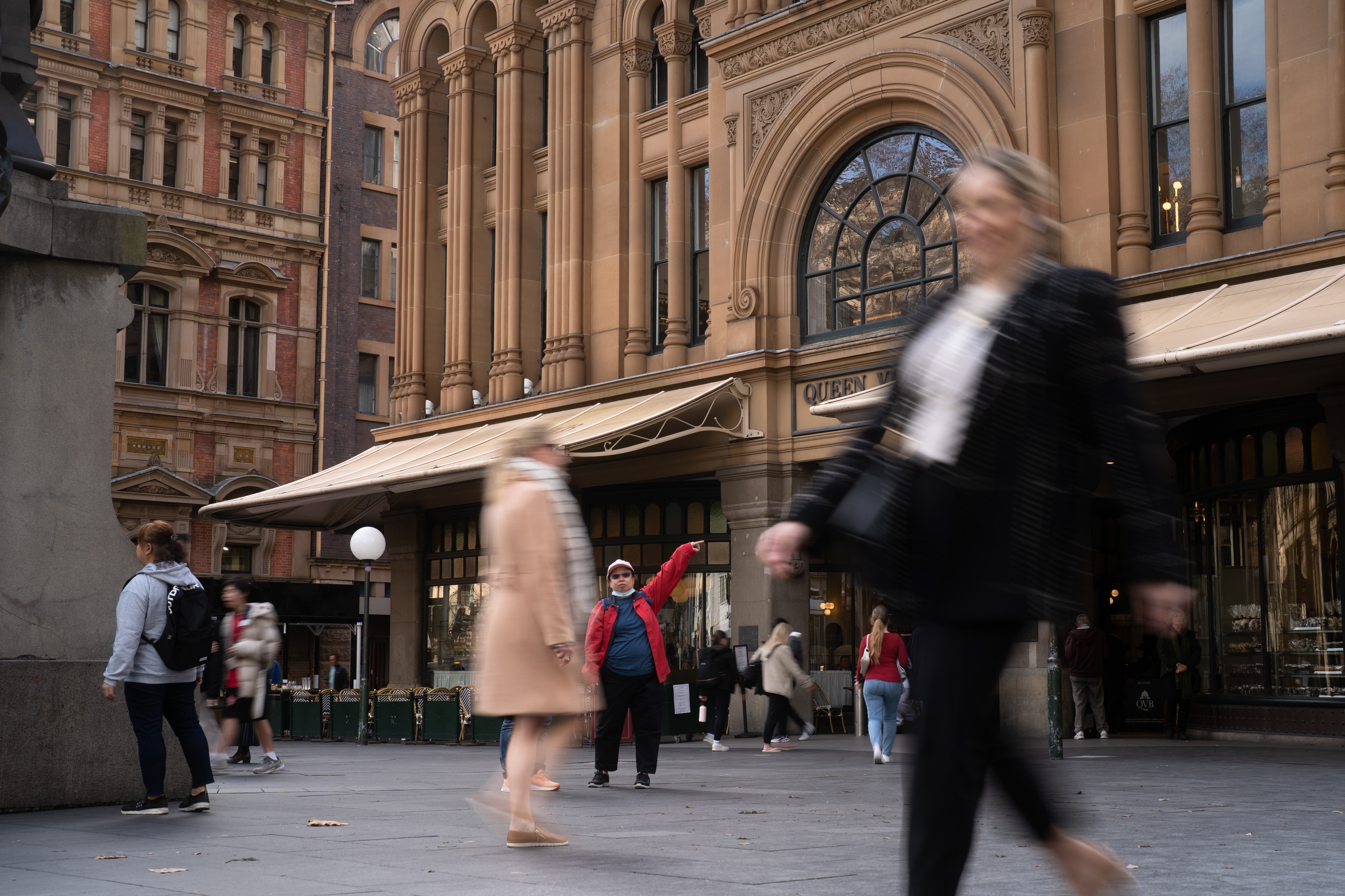 Various people seen in a crowded suburb of Sydney