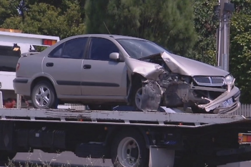 A beige Nissan sedan after a collision at Croydon in Melbourne's east