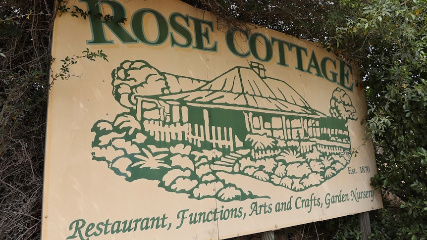 Sign outside historic Rose Cottage buildings at Tuggeranong.