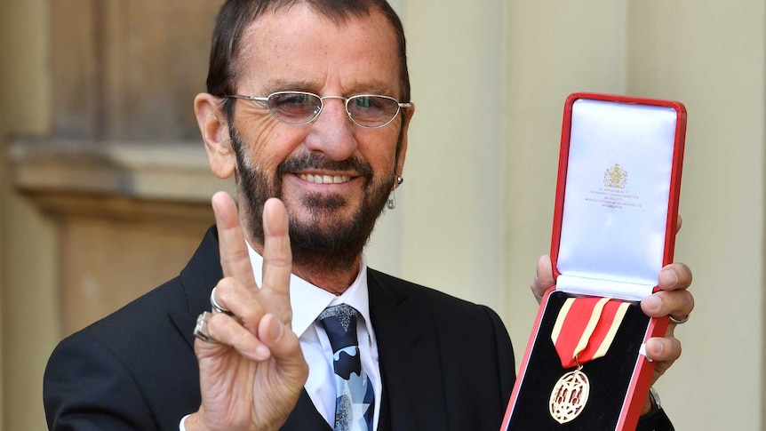 Ringo Starr, whose real name is Richard Starkey, poses after receiving his Knighthood.