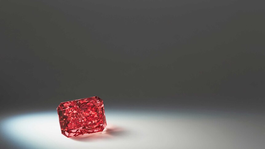 A close up of a red diamond
