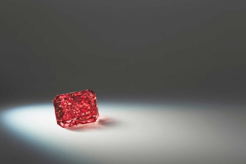 A close up of a red diamond