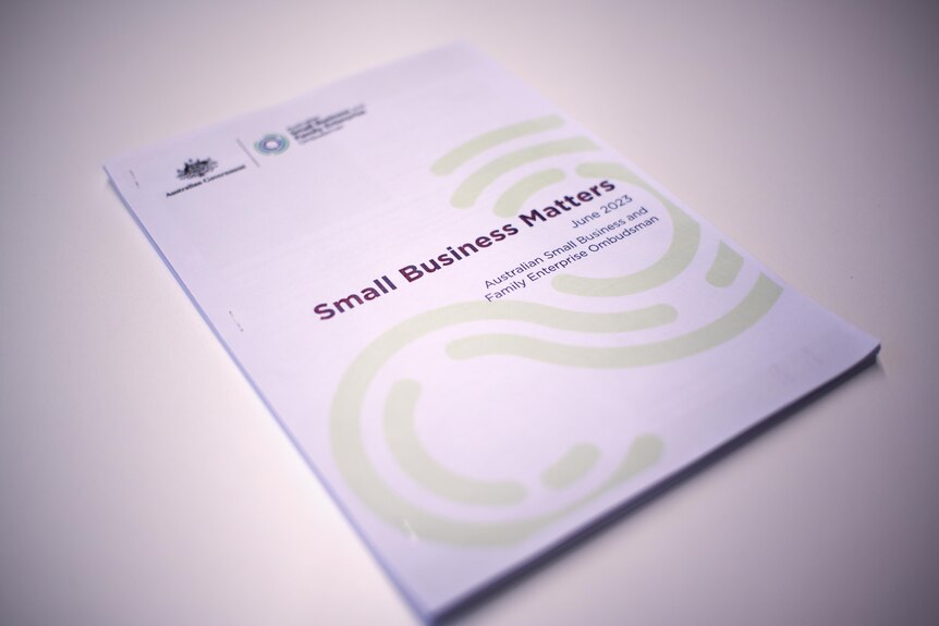 A report on a desk, white page, Small Business Matters title, Australian government coat of arms on the left side.