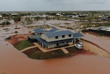 A home surrounded by floodwaters.