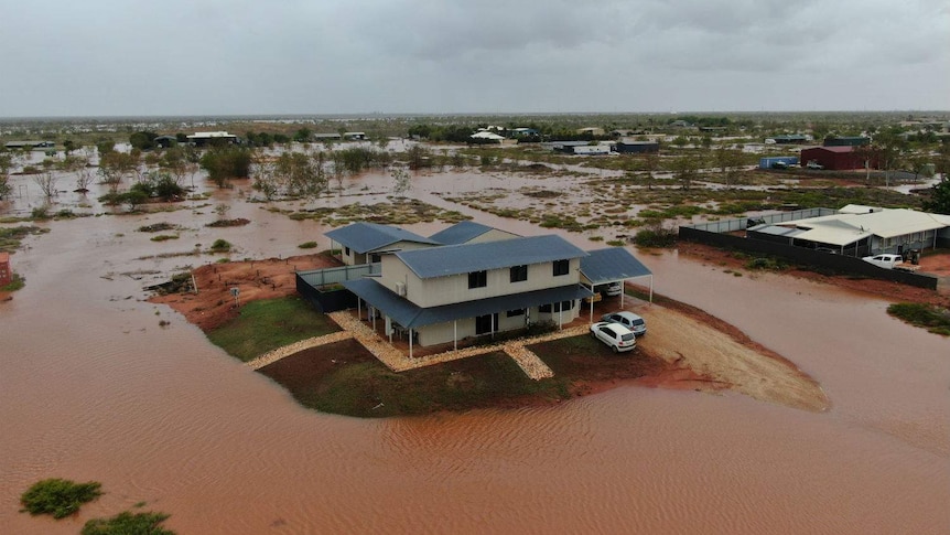 A home surrounded by floodwaters.