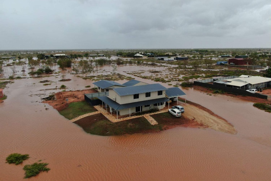 A home surrounded by floodwaters.