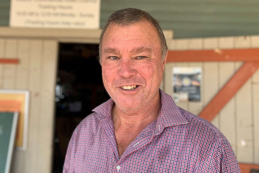 Ian Simpson smiles outside his Western Star Hotel Motel in Windorah