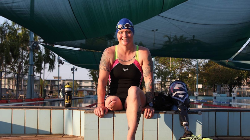 A photo of Invictus Games athlete Sonya Newman sitting in training gear near a swimming pool.
