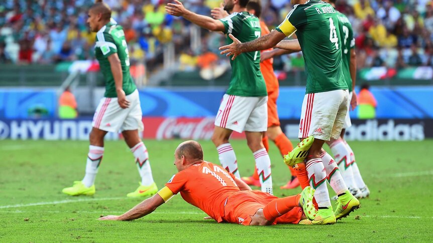 Robben goes down in the penalty area against Mexico
