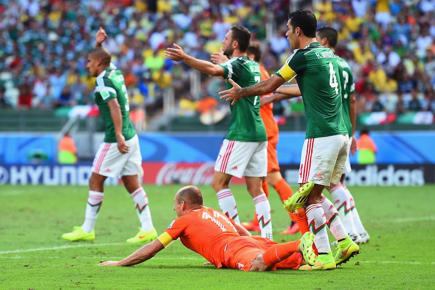 Robben goes down in the penalty area against Mexico