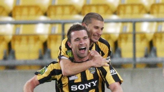 Phoenix rising... Tim Brown and Costa Barbarouses celebrate the first of Wellington's three goals.