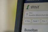A computer screen with the Stayz website getting visited