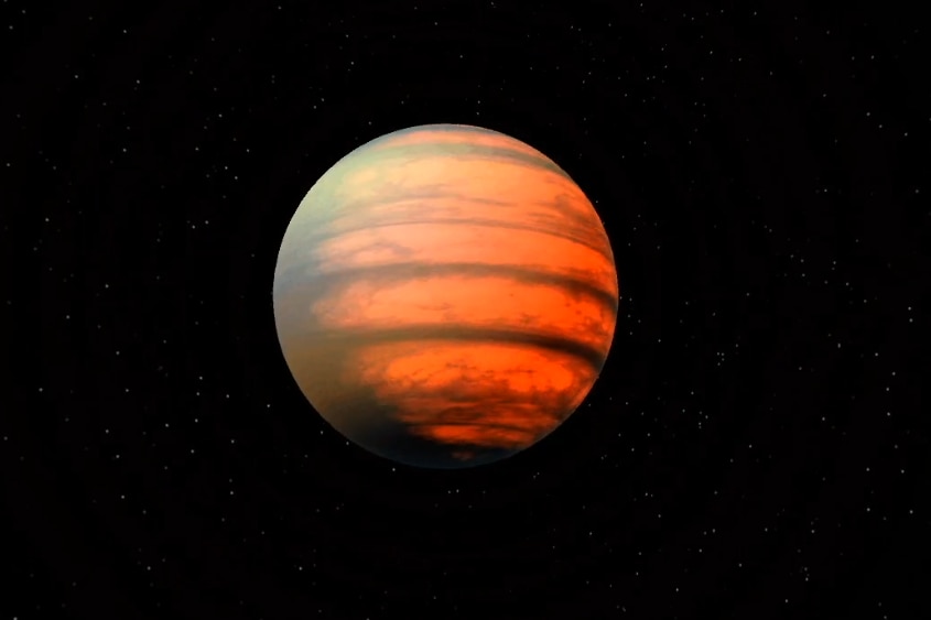 Picture of an orange and brown mottled planet against a black background.