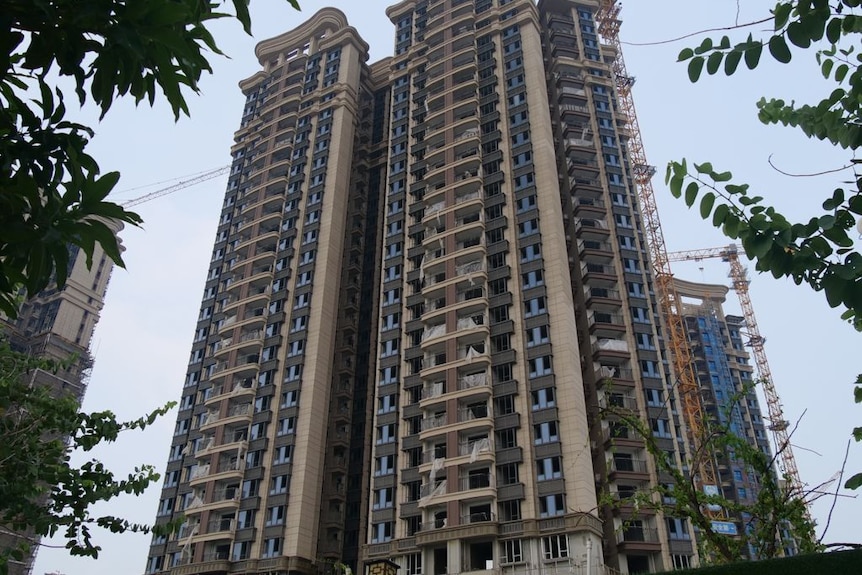 A tall half-built apartment building. 