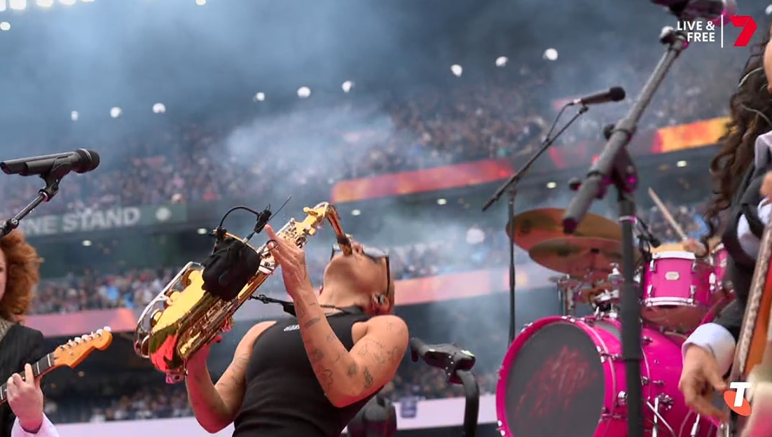 G Flip plays the saxaphone