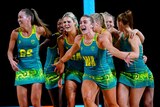 Australian players celebrate after winning the Netball gold medal match