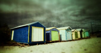 Storm clouds over beach boxes