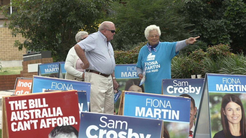 Party signs in outside a pre-polling booth in the seat of Reid