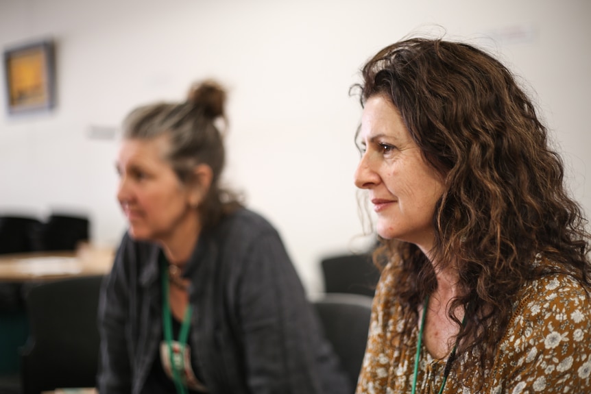 Co-facilitators, Sonia Stocco right and Lucy Young, blurred in the background, on the left.