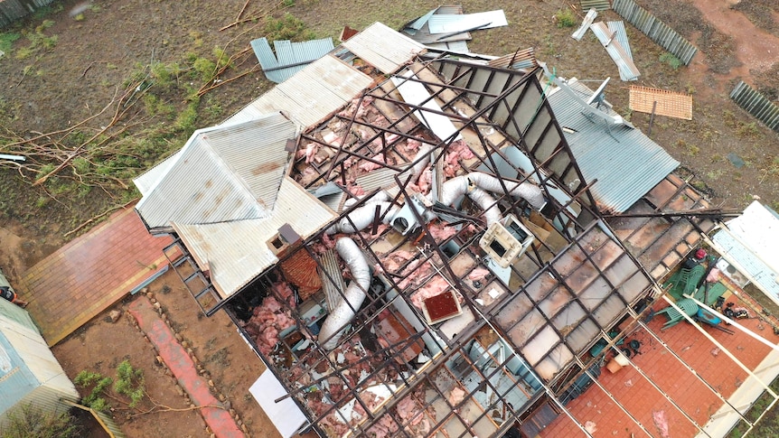 A house that has had its roof blown off in a storm