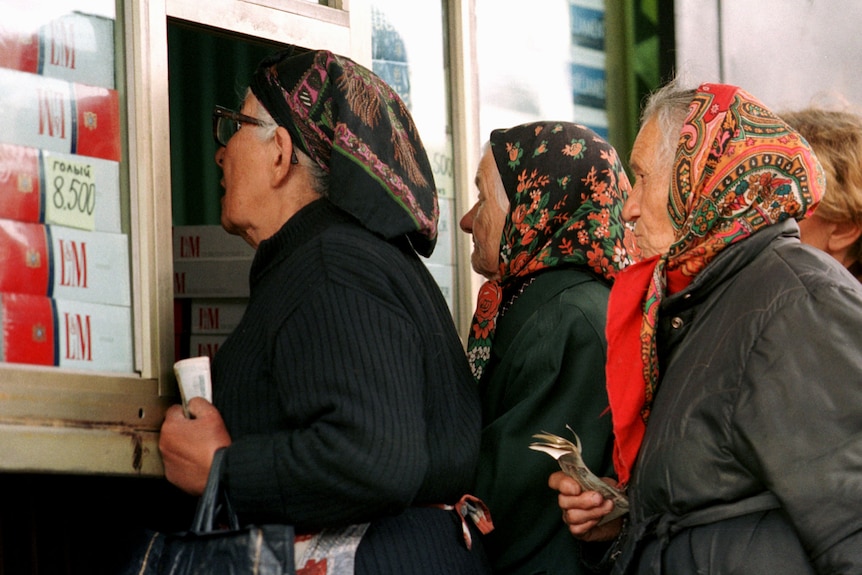 Russian women queue to buy cigarettes