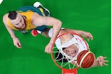 China's Zou Yuchen  shoots past Australia's Aron Baynes