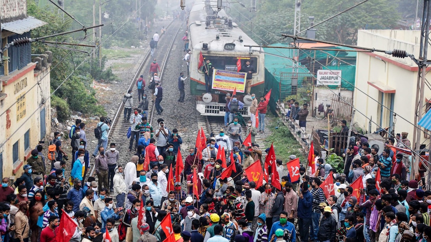 Supporters of leftist parties block a train track during a nationwide shutdown in India