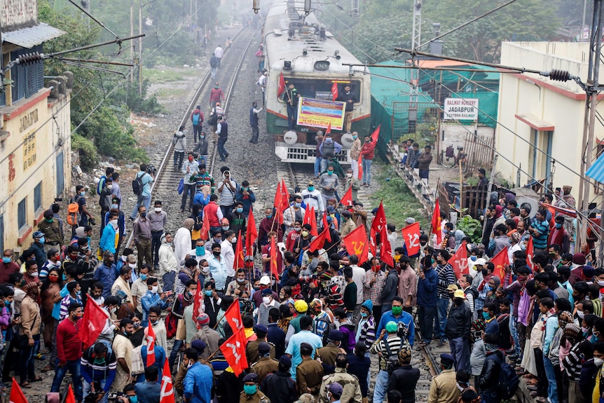 Supporters of leftist parties block a train track during a nationwide shutdown in India